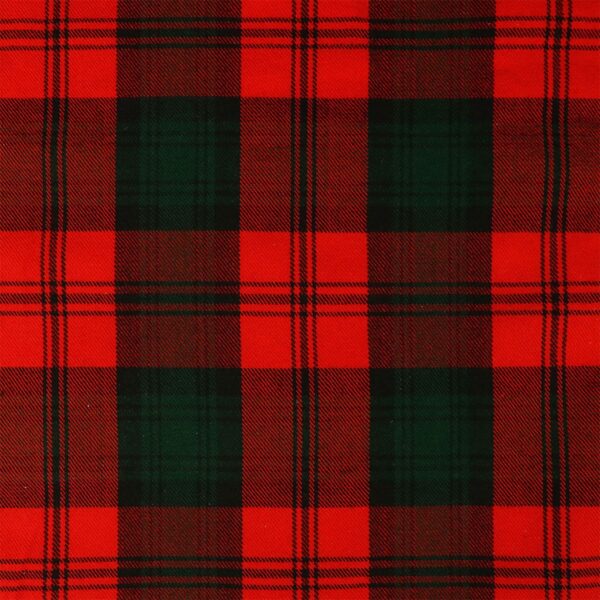 A red and green plaid fabric with a Learn to Play Bagpipe Book.