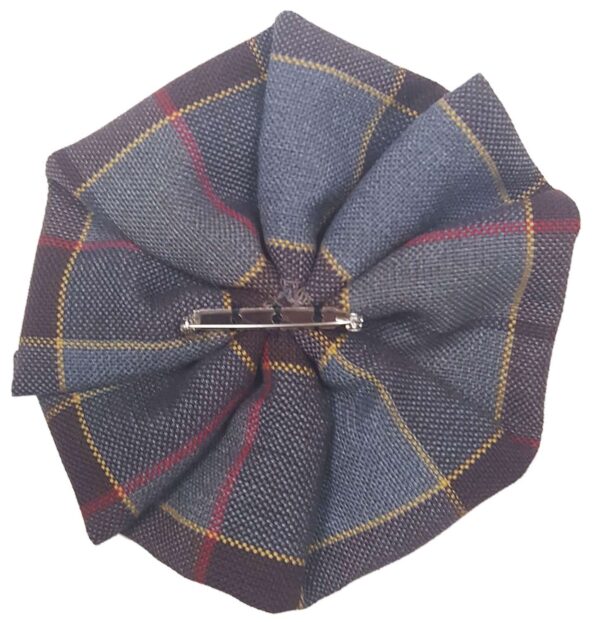 An OUTLANDER-themed brooch with a OUTLANDER Tartan Rosettes - Premium Wool rosette.