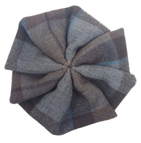 A brown and blue plaid OUTLANDER Tartan Rosettes - Premium Wool bow tie on a white surface.