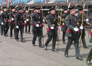 A royal company of Scottish men in uniform.