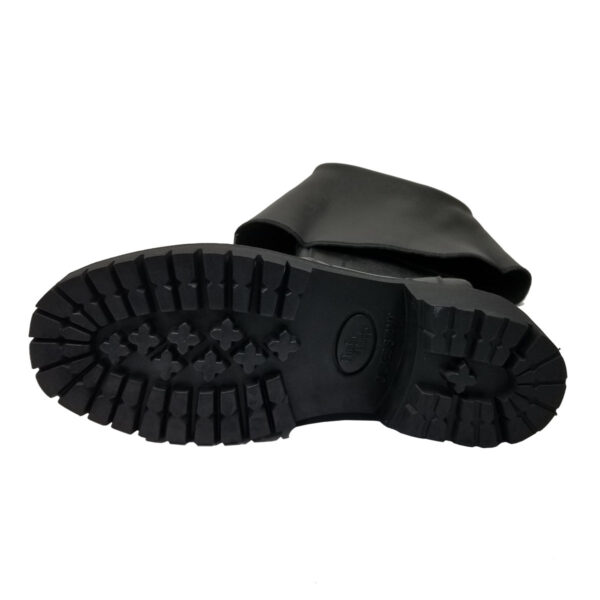 Since the given product name is the same as the one already in the sentence, no replacement is necessary. Therefore, the sentence remains:

"The Black Scottish Pirate Boots are laid on their side, displaying the durable tread on the bottom sole.