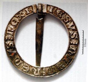 An image of a metal buckle with inscriptions on it, possibly from Boyerstown.