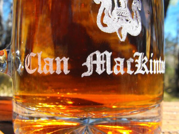 A Clan Crest 26 oz Stein Beer Mug with a clan crest on it.