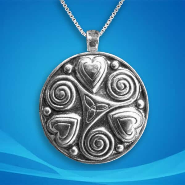 The Lovers Spiral Hearts Sterling Silver Pendant features a design of intertwined lovers' spiral hearts, elegantly hanging on a sterling silver chain against a blue backdrop.