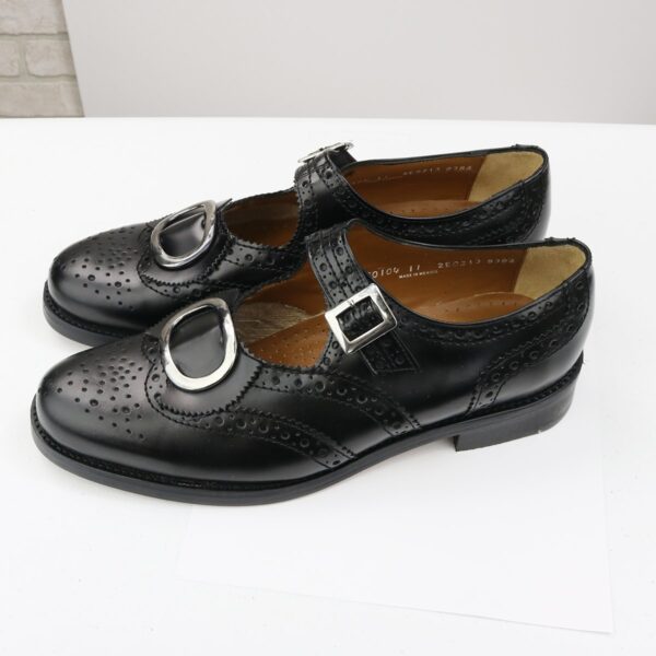 A pair of black Leather Buckle Brogues - Size 11 shoes with buckles on them.