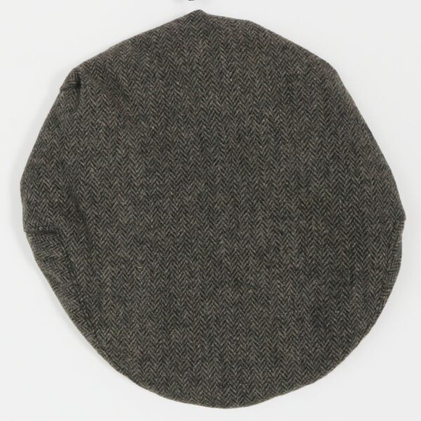 A Grey Tweed Driving/Golf Cap on a white surface.