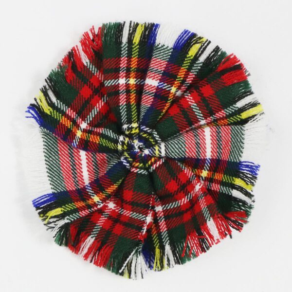 A Robertson Hunting Ancient Wool-Blend Tartan rosette with a red, green, and blue pom pom on a white surface.