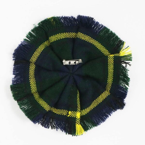 A green and yellow Robertson Red Modern Wool-Blend Tartan beanie with a Rosette design on a white surface. - Sold 11/23