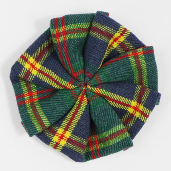 A Leatherneck Wool-Blend Tartan Rosette on a white surface.