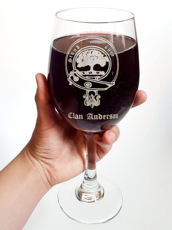 A person holding a Clan Crest 18 oz Wine Glass.