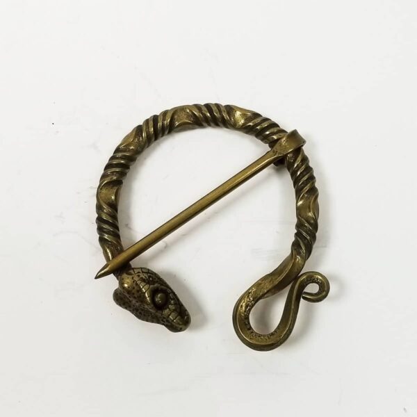 A bronze snake penannular brooch-sold on a white surface.