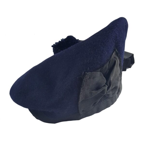 A Navy Blue Felted Wool Balmoral with a black bow on it.