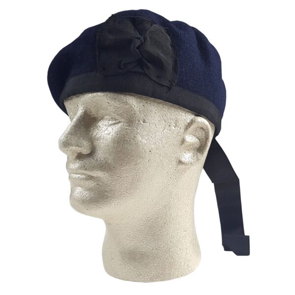 A mannequin wearing a Navy Blue Felted Wool Balmoral with black ribbon.