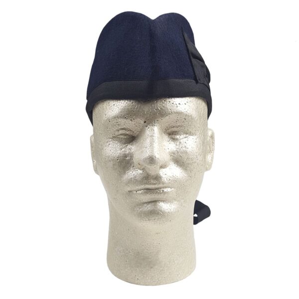 A mannequin wearing a Navy Blue Felted Wool Glengarry with a Glengarry vibe.