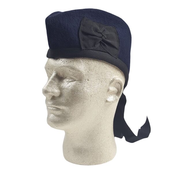 A Navy Blue Felted Wool Glengarry hat with a bow on it.