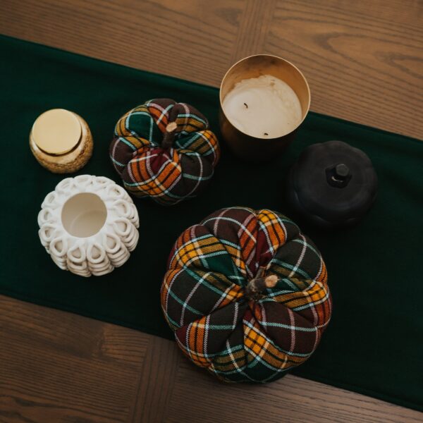 Stewart Dress/MacKenzie Tartan Mantel Runner - Homespun Wool Blend plaid pumpkins and candles on a table.