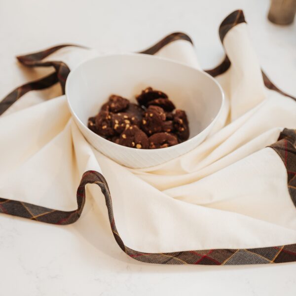 A bowl of chocolate covered in an Outlander Fraser Edge Tartan Towel- Poly/Viscose Wool Free.