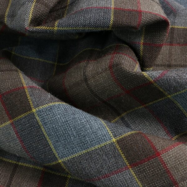 A close up of an Outlander Neck Warmer Cowl Scarf - Premium Wool fabric with a plaid pattern.