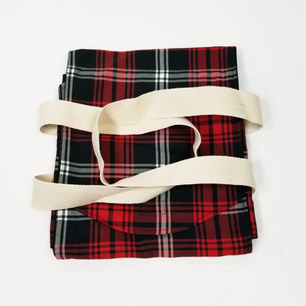 A Prince of Wales Small Tartan Casserole Carrier - Poly/Viscose Wool Free with red and black plaid pattern on a white surface.