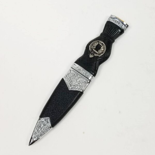 A black MacArthur Clan Crest Standard Sgian Dubh knife on a white surface.