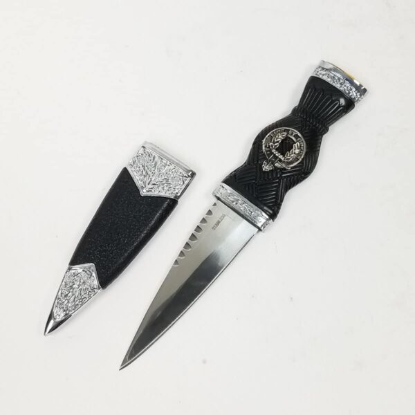 A black and silver MacArthur Clan Crest Standard Sgian Dubh on a white surface.