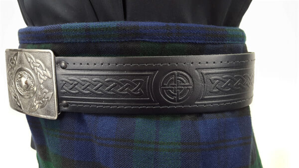 A scottish kilt with a Celtic Embossed Quality Leather Kilt Belt and buckle.