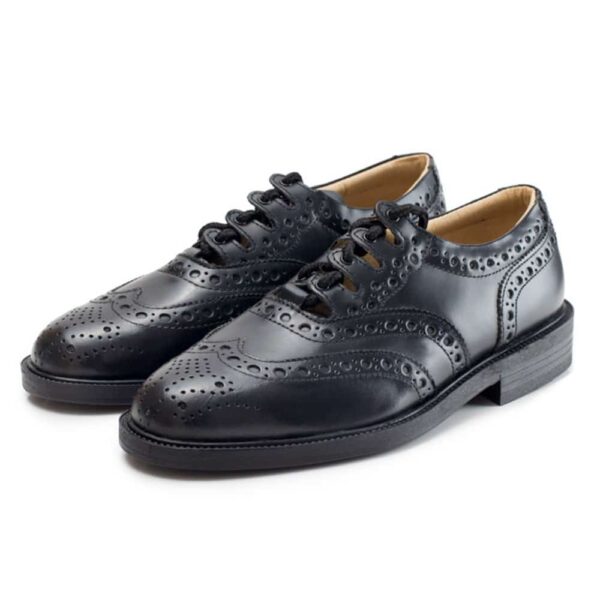 A pair of Leather Sole Ghillie Brogues with a sole on a white background.