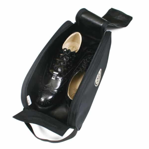 A Ghillie Brogues Carry Bag with a pair of shoes inside, ready to be carried or rolled up.