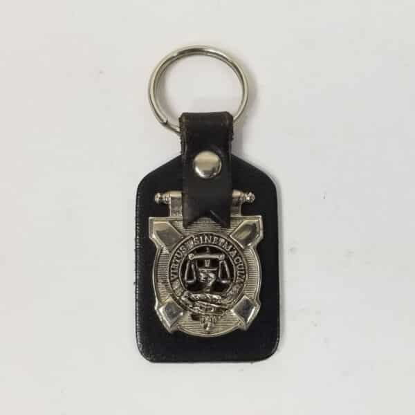 A Russell Art Pewter Clan Crest Key Fob made of leather, showcasing a badge.