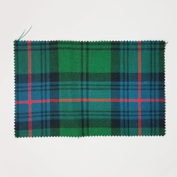An Armstrong Ancient Medium Weight Premium Wool Tartan Swatch featuring a green and blue pattern on a white surface.