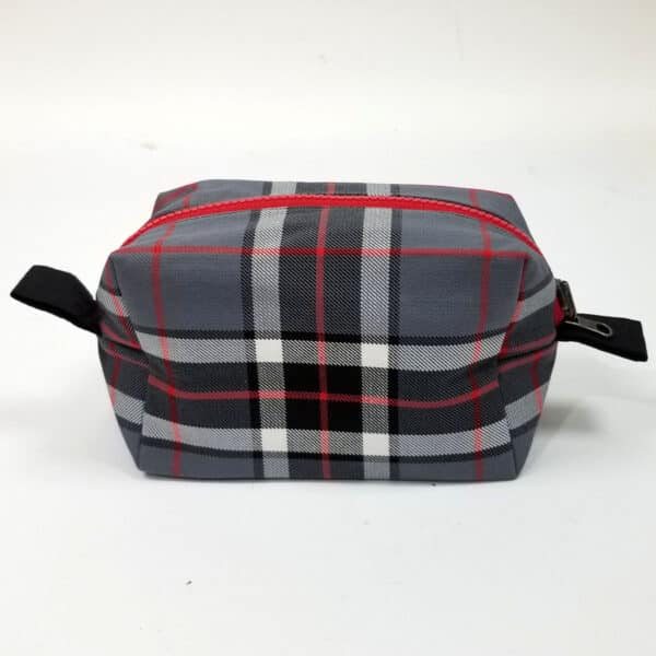A Thomson Grey Tartan Box Pouch - Poly/Viscose Wool Free toiletry bag on a white surface.