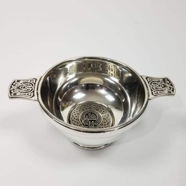 An ornate silver Stewart Clan Crest Quaich - 4 Inch with a clan crest design.