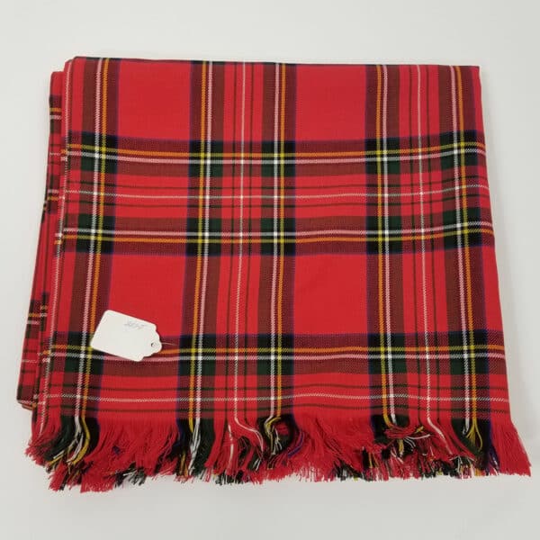 A Stewart Royal Tartan Queen Size Bed Runner - Poly/Viscose Wool Free with tassels, perfect as a tartan bed runner for a cozy and stylish touch.