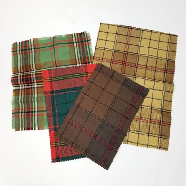 Four different Varius Premium Wool Tartan Swatches on a white surface.