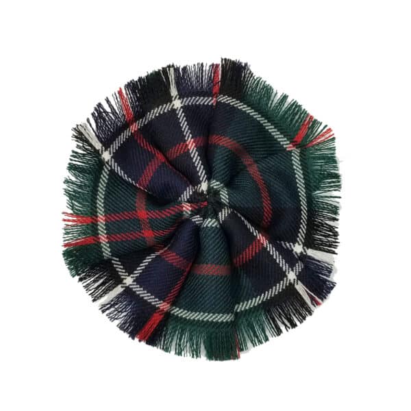 A Fringed Tartan Rosette with fringed edges arranged in a circular pattern, crafted from light weight wool.