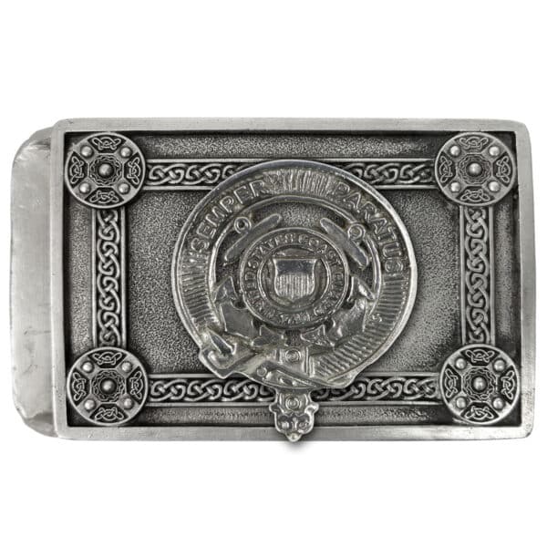 The **U.S. Army Pewter Kilt Belt Buckle** is a rectangular silver object with intricate designs and a circular emblem at the center that reads "Semper Paratus" around a shield with stars and a key. It features four decorative round elements at the corners.