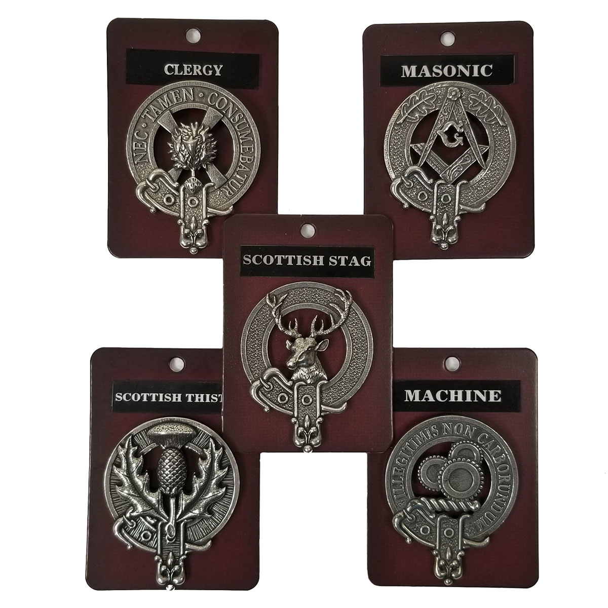 Five assorted cap badges from the "Assorted Cap Badges/Brooches" collection, mounted on red and black cards. Each badge is labeled as "Clergy," "Masonic," "Scottish Stag," "Scottish Thistle," and "Machine," and features unique emblems corresponding to its label.