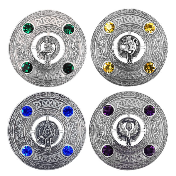Four elaborate Crest and Gem Plaid Brooches feature intricate Celtic designs, each embellished with six vibrant gemstones. Every brooch showcases a distinct central emblem, including a lion, a unicorn, a dragon, and a thistle.