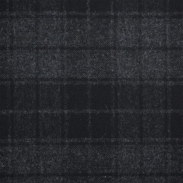 Close-up of a dark grey and black tartan fabric from the Grey Highlander series, featuring a subtle checkered pattern. The material appears textured with a slight woolen feel.