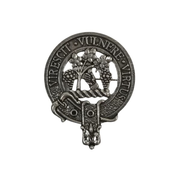 The Burnett Cap Badge is a metallic piece adorned with two trees intertwined with vines and encircled by a ribbon that bears the Latin phrase "Virescit Vulnere Virtus.