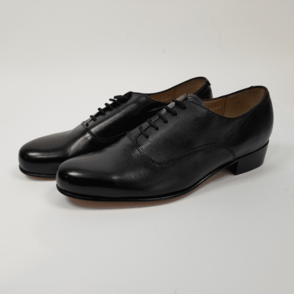 A pair of Oxford Dancing Brogues - 9.5, black leather dress shoes with laces, displayed on a white background.