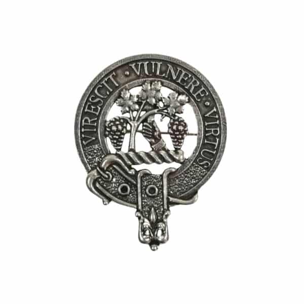 The Burnett Cap Badge is a metallic piece adorned with two trees intertwined with vines and encircled by a ribbon that bears the Latin phrase "Virescit Vulnere Virtus.