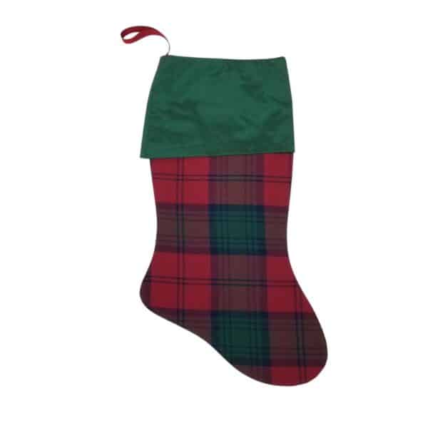 The Lindsay Modern Tartan Stocking captures classic charm with its red and green plaid design, complemented by a green cuff and a red hanging loop.