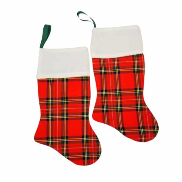 A pair of Tartan Stockings featuring a red tartan pattern, white cuffs, and green hanging loops.