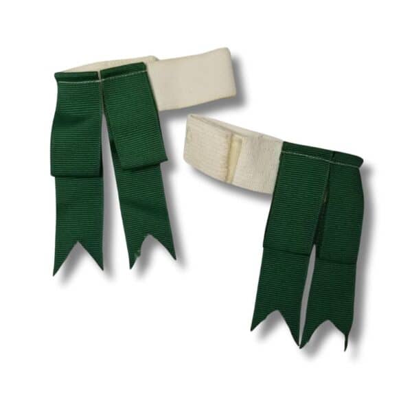 Two white and green equestrian hair bows with ribbon streamers resemble vibrant Green Kids Flashes on a white background.