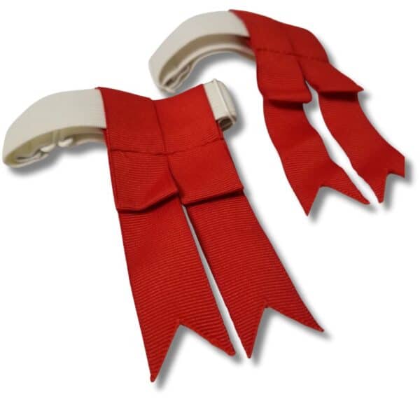 Red ribbon shoulder epaulettes with white strap attachments on a white background, subtly reminiscent of Used Black Kids Flashes.