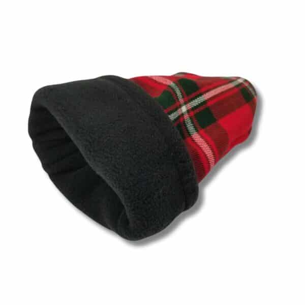 A MacGregor Modern Golf Club Cover, featuring a red and green plaid fleece design with black lining, lies on a white surface.