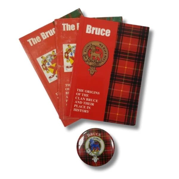 Three copies of the product titled "Armstrong Clan" with tartan covers pay homage to the Armstrong Clan, accompanied by a round pin featuring a lion and crest.