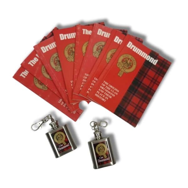 Eight red "Armstrong Clan" booklets are spread out on a white surface, accompanied by two small silver keychain flasks with matching labels, subtly nodding to the proud heritage of the Drummond line.