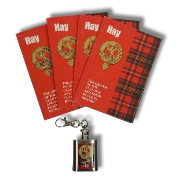 Armstrong Clan Hay booklets with a plaid design, alongside a small keychain flask featuring the Armstrong clan crest.